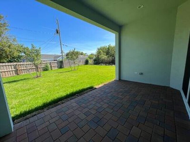 Building Photo - This Charming Brand-New Home is a 4/3 with...