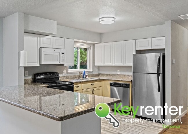 Building Photo - Updated 4-Bedroom, 2-Bath Tacoma Home for Rent Near Tacoma Community College and 6th Ave!