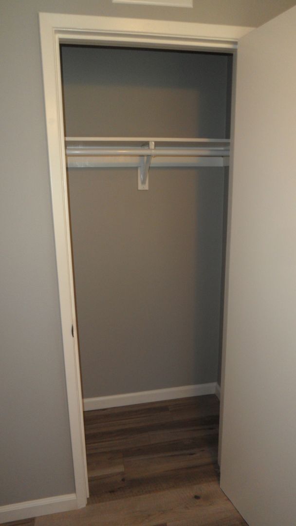 Building Photo - REMODELED 2BR; 1BA end unit condo w/ 1 car garage & 1 parking space