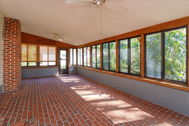 Building Photo - Run don't walk for this one of a kind beautifully maintained Old Florida Charmer on a park like d...