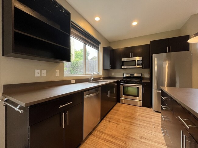 Building Photo - Charming 3 Bedroom, 2.5 Bathroom Home with Large Living Room, Tall Windows, Island Kitchen, and A...