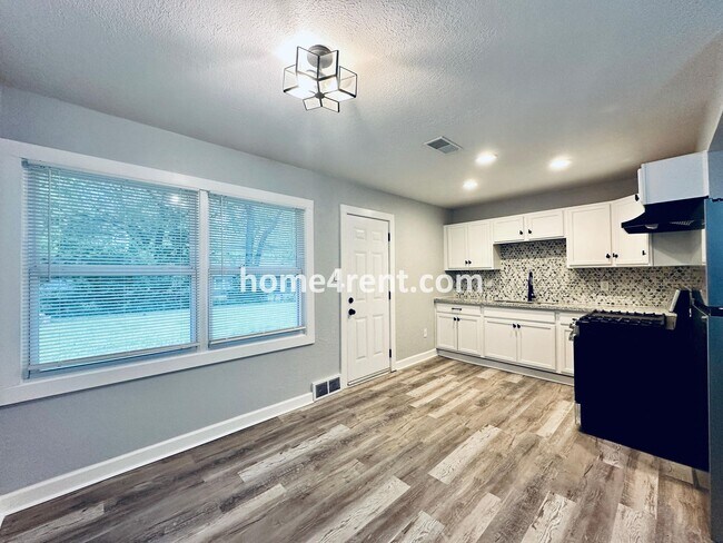 Building Photo - Lovely Three Bedroom Home in KCMO and an Updated Kitchen  w/ Granite and SS Appliances, including...