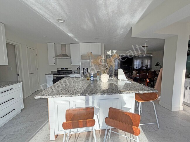 Building Photo - Stunning 3_Bed Home with Two Primary Suites & a Pool!