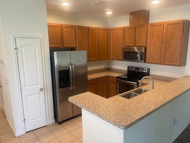 Building Photo - Enjoy Stylish Townhome Living in Vibrant B...