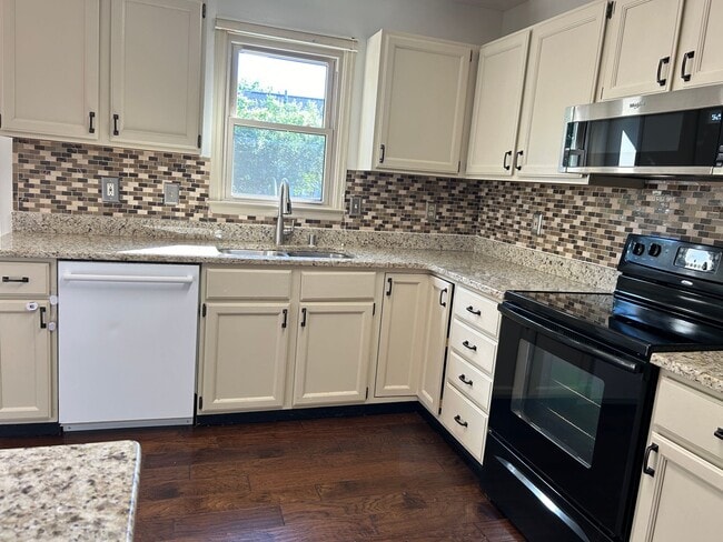 Building Photo - 4 Bedrooms with Finished Basement and Bonu...