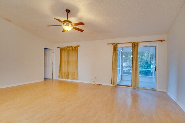 Building Photo - Energy-Efficient 3BR/2BA Solar Home in Pace with Screened Porch, Fenced Backyard, Updated Kitchen...