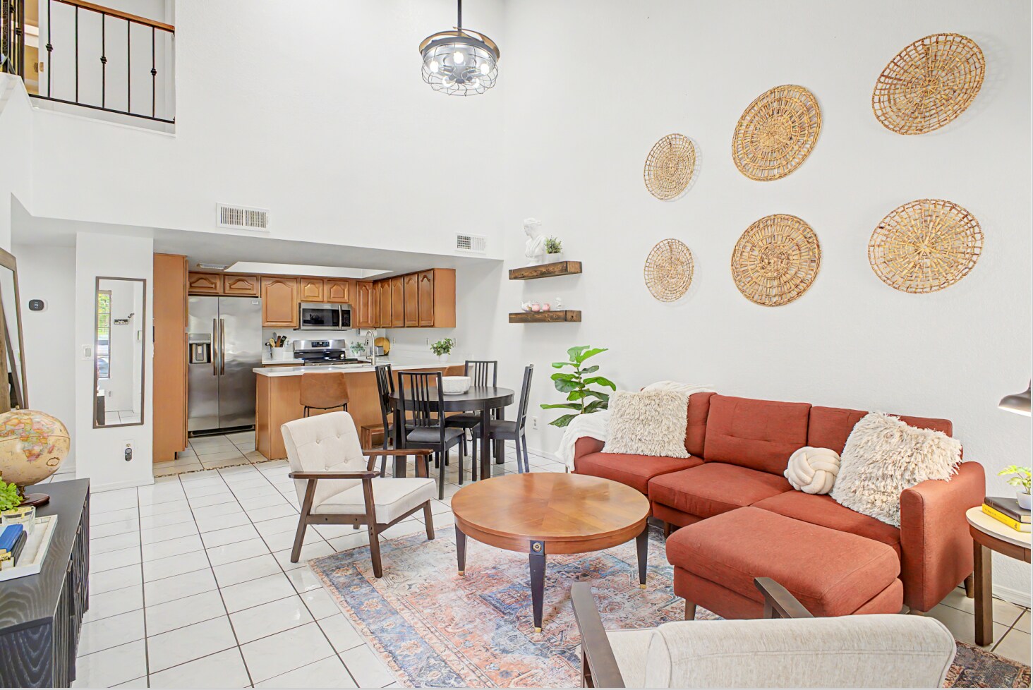 2 Story living room designed to feel like home. - 819 N College Ave