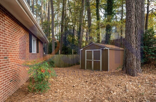 Building Photo - Charming Brick Ranch on a Spacious, Wooded Lot!
