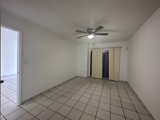 Main bedroom has patio access - 21444 NW 40th Circle Ct