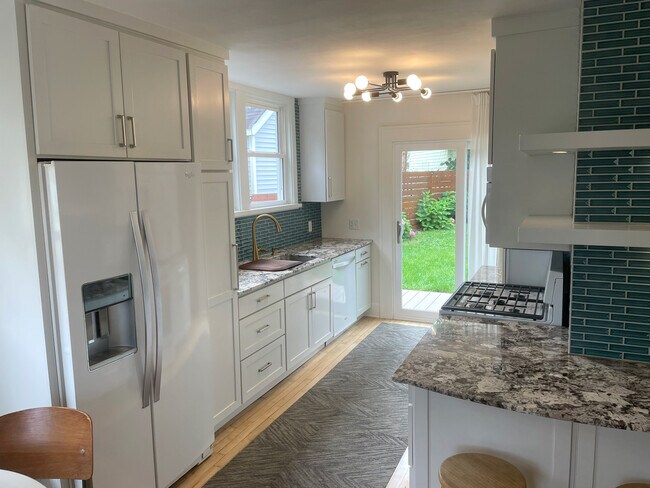 Updated kitchen open to private backyard - 3209 Atwood Ave