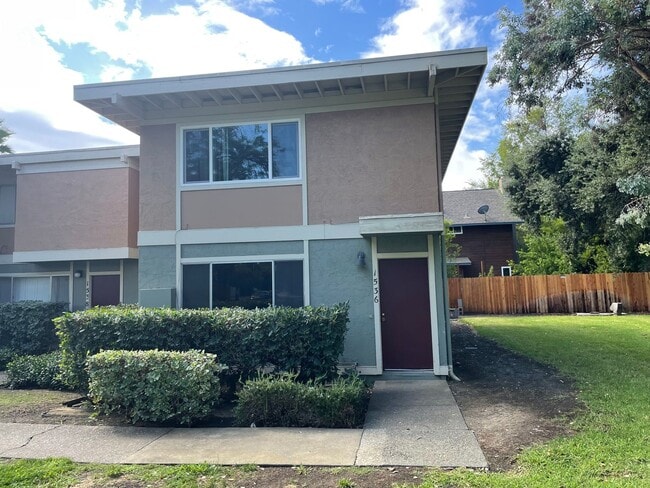 Building Photo - Step into a beautifully refreshed 3-bedroom, 1.5-bath condo that blends comfort, style, and unbea...