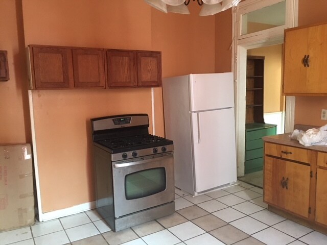 Kitchen. Fridge and range is included. Stackable washer/dryer is located in eat-in kitchen - 8226 Cohn St