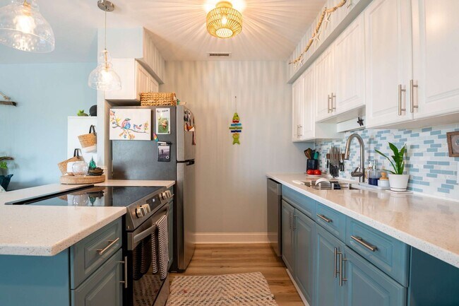 Building Photo - OFF-SEASON FURNISHED OASIS JUST STEPS FROM THE SAND