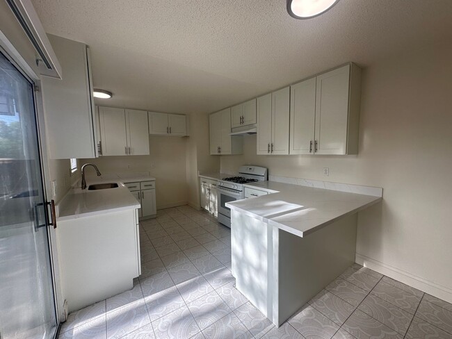 Building Photo - Recently Updated 4 Bedroom Home with Yard