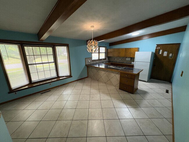 Building Photo - Spacious Home with Attached Garage & Fenced Backyard