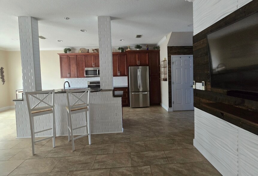Living room looking into kitchen - 802 King Neptune Ln