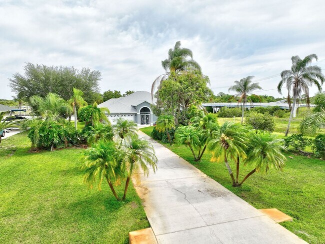 Building Photo - A BOATER'S PARADISE WITH THIS STUNNING 3 BEDROOM, 2 BATH WATERFRONT POOL HOME W/DOCK & BOAT LIFT ...