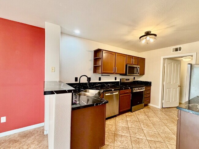 Building Photo - UPGRADED 2 BEDROOM TOWNHOME | SOLAR + PRIVATE YARD | SILVERADO RANCH / HENDERSON