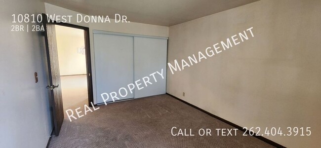 Building Photo - Two Bedroom Upper Condo w/ Utilities Included