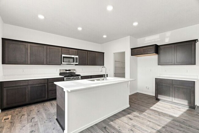 Building Photo - Spacious 5-Bedroom with Loft with 3-Car Garage