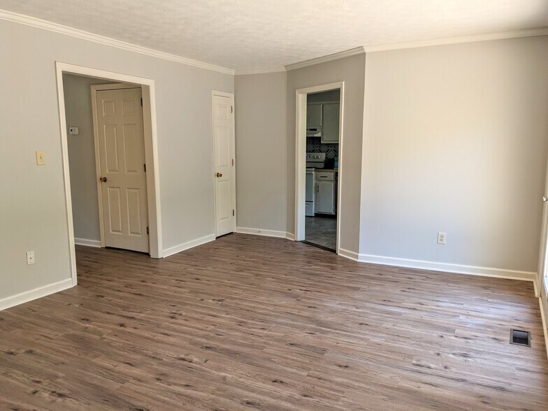 Living Room viewed from left of fireplace. - 3221 Hunters Point Dr
