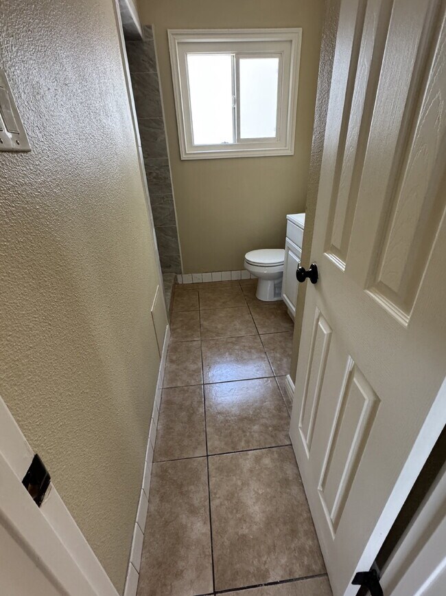 Building Photo - Large yard, spacious interior, extra parking and much more