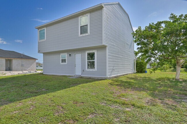 Building Photo - 3BR/2.5BA Cape Coral Home w/ 2-Car Garage & Spacious Yard – Available Now!