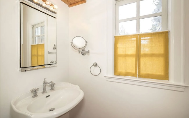 Building Photo - Charming Spanish Style Cottage with Incredible Deck- Gardener's Delight!