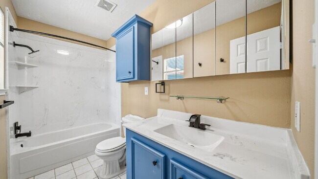 Building Photo - Enjoy comfortable, low-maintenance living in this updated, pet-friendly, carpet-free 3-bedroom ho...