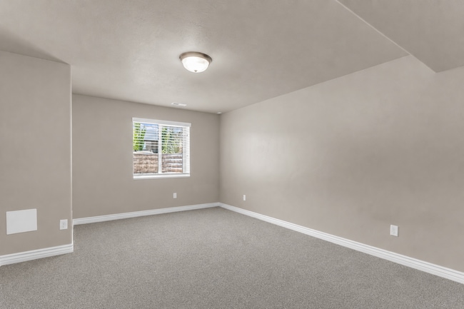 Building Photo - Spacious Syracuse Home with Covered Deck, Loft & Oversized 3-Car Garage