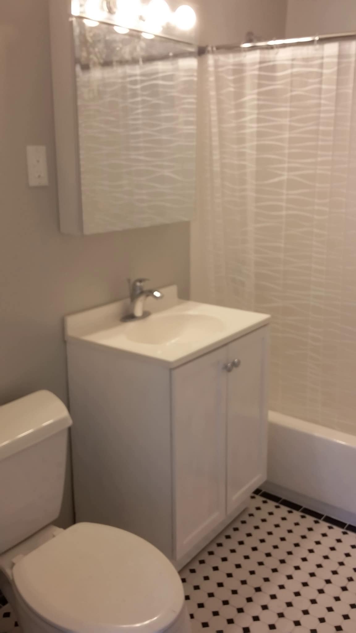 Bathroom 1 - new tile, tub, and vanity - 1518 Irving Ave N