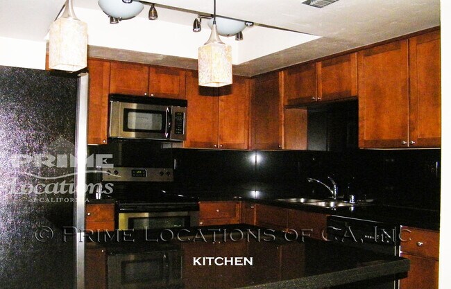 Building Photo - Experience Downtown Living with this upgra...