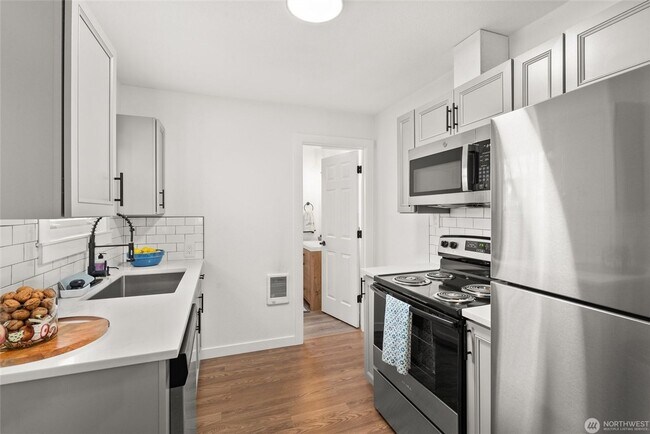 Building Photo - Updated South Tacoma Gem: Large Corner Lot & Covered Deck