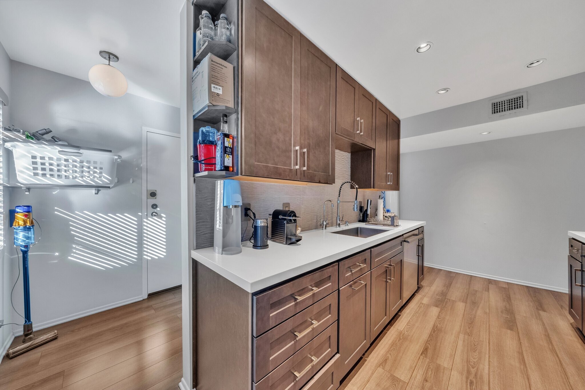 Kitchen and entrance to laundry room - 909 N Sierra Bonita Ave