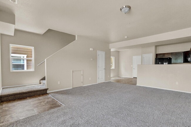 Building Photo - Modern Townhome with Central A/C, 2-Car Ga...
