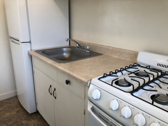 Building Photo - Central Location with Free Utilities!