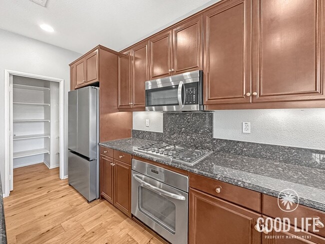 Building Photo - Elegant 3BR Residence in Exclusive Gated Community w/ AC & Garage!