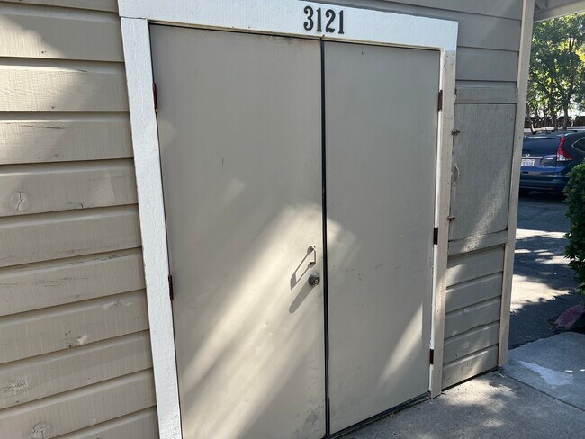 Designated locked storage, big enough for bicycles. - 3121 Woods Cir