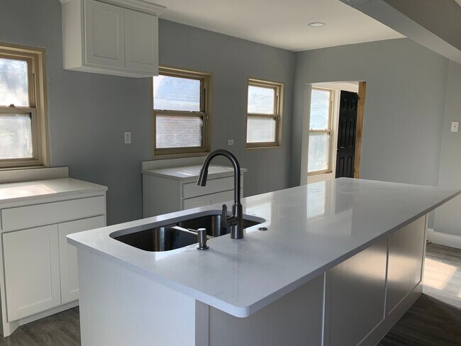 Kitchen- barn door to sunroom open - 3816 Byers Ave