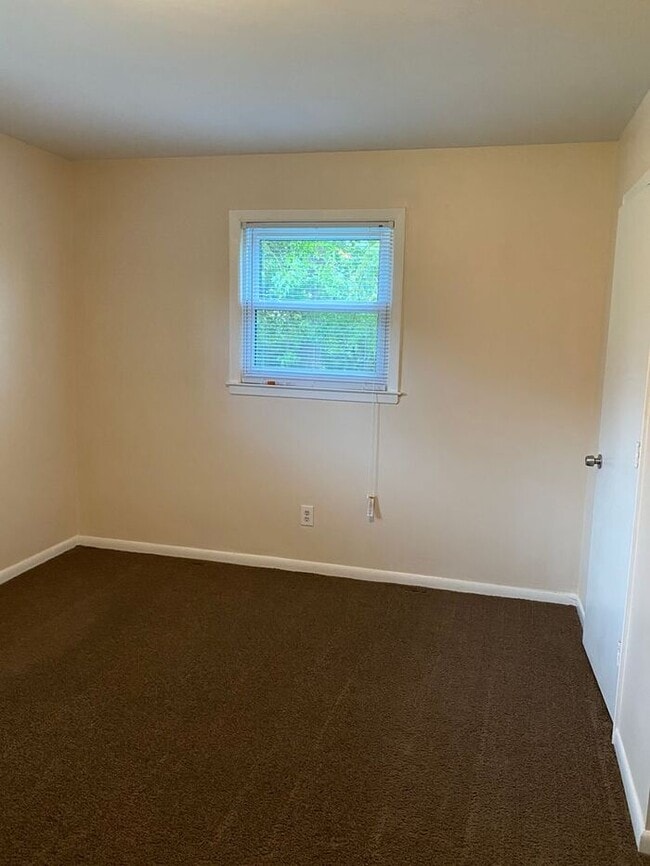 Building Photo - COMING SOON! 4Br, 2.5 baths, large kitchen, large bedrooms, fence, storage and more! N. College R...