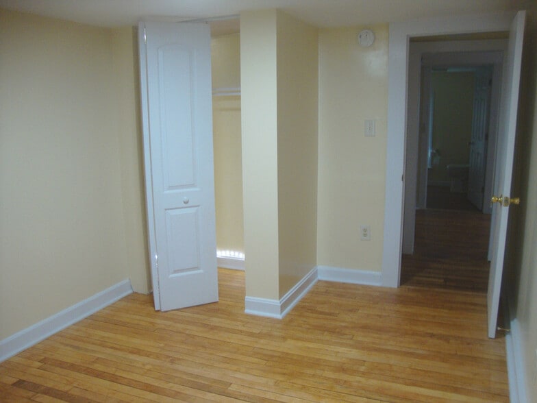 First bedroom toward closet and doorway to laundry area and living room. - 351 W Currant St