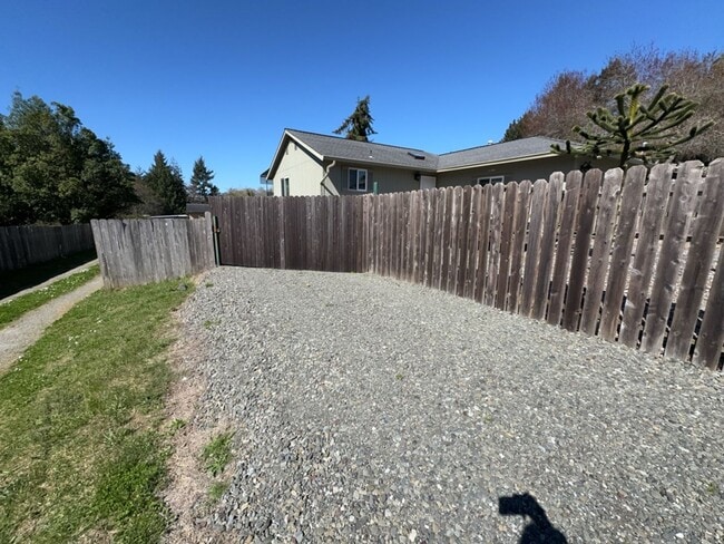 Building Photo - Newley updated 3-bedroom home features fenced yard, garage, and covered patios!