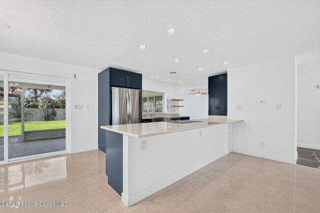 Building Photo - Welcome to this beautifully remodeled 4-bedroom, 3-bath home in the heart of Indialantic Beach!
