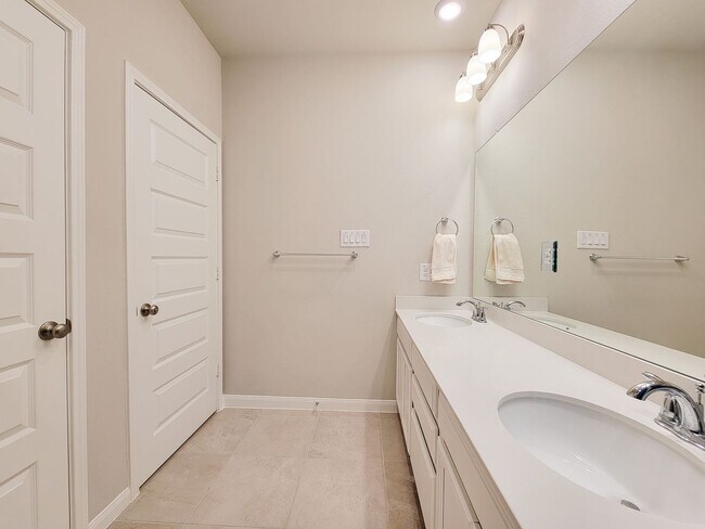 Building Photo - A true gem on a quiet corner lot, this spacious and sun-filled home is tucked away from street no...