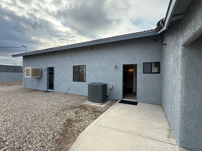 Building Photo - Available now - Unfurnished - Long Term