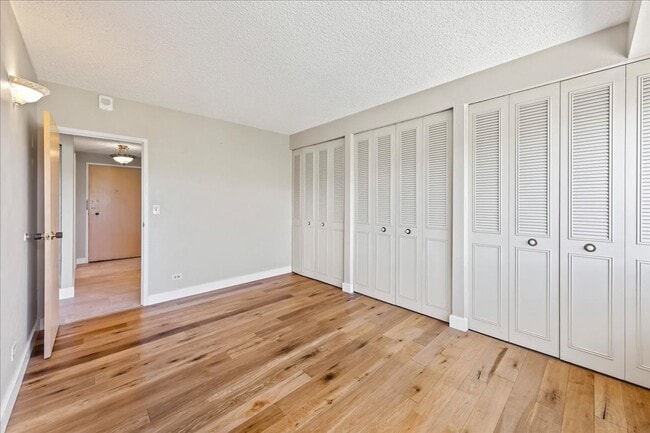 Building Photo - Stylish Imperial Plaza Condo in Prime Downtown Location