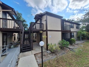 Building Photo - Second Floor Annual rental available now in the 55+ condominium community of Cedar Woods.