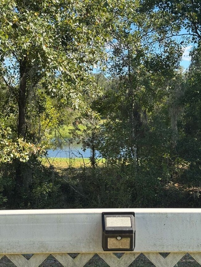 Building Photo - COMING SOON! Beautiful 4BR 3BA Home w/ Screened Lanai & Pond View • Garage Parking • Fenced Yard ...