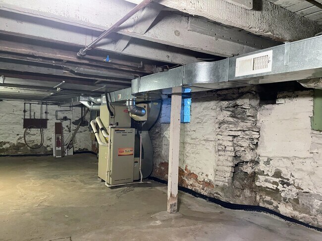 Dry basement with French drain and sump pump for additional storage - 212 Lorenz Ave
