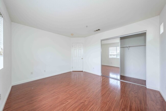 Building Photo - Gated Townhome with Updated Kitchen and Private Backyard